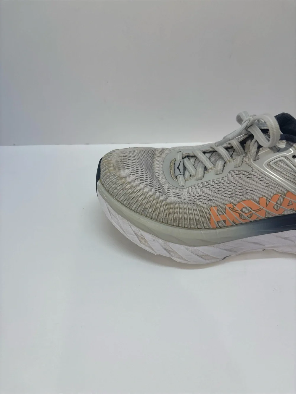 Hoka women’s size 7 gray/peach Bindi 7 style #110531 LRBI in fair condition.